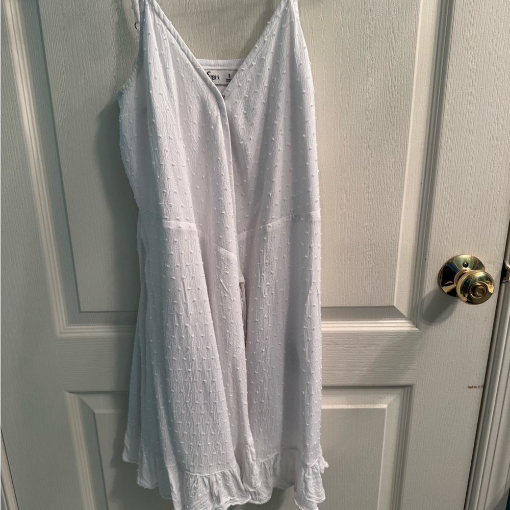 White Sleeveless Dress with Ruffle Hem